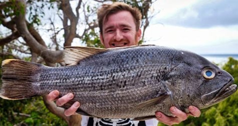 holding up a fish